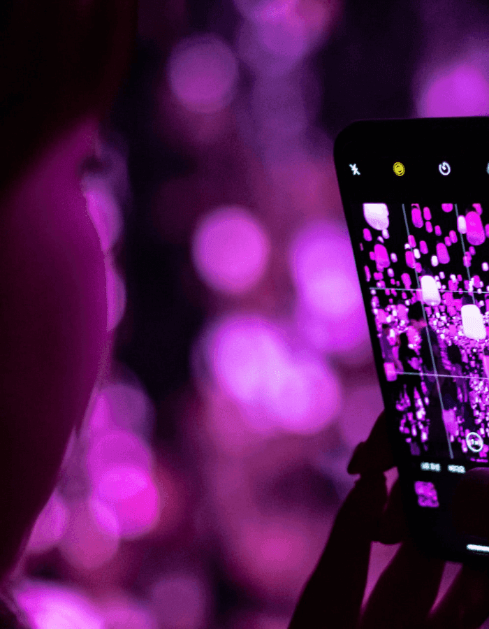 close up image of woman on phone taking picture